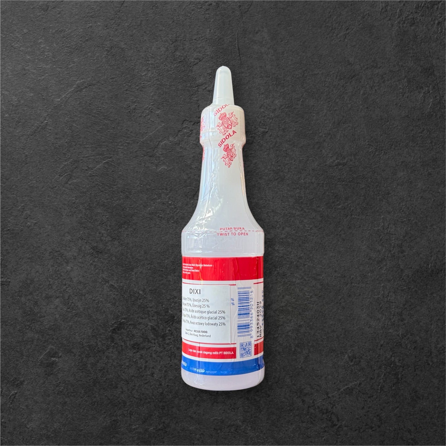 Dixi Essig von Nesia Food in einer Flasche, klar und braun, ideal zum Kochen und Würzen in der Küche